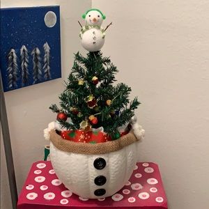 Christmas tree decoration in a snowman bucket